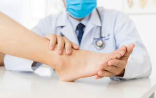 Neuropathy Specialist Lakeland at Lakeland Foot and Ankle examining a patient’s foot for nerve pain and diabetic neuropathy care.