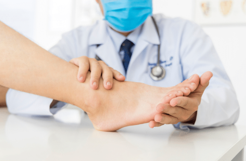 Neuropathy Specialist Lakeland at Lakeland Foot and Ankle examining a patient’s foot for nerve pain and diabetic neuropathy care.